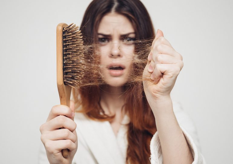 Why do teenagers "often and thickly" lose their hair and is this a cause for concern?
